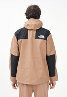 THE NORTH FACE Giacca a vento Reign On marrone e nera da uomo NF0A8B5G58W1 . THE NORTH FACE 