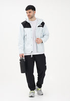 THE NORTH FACE Giacca a vento Reign On celeste e nera da uomo NF0A8B5GJL61 . THE NORTH FACE 