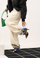 MARCELO BURLON COUNTY OF MILAN Pantalone sportivo panna da donna con stampa ali sul fondo 25ICM30074 LASK MARCELO BURLON COUNTY OF MILAN 