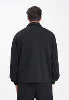GCDS Felpa con zip nera per uomo e donna caratterizzata da lavorazione monogram B2CM0500TQ6 99 GCDS 
