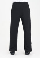 GCDS Pantalone sportivo nero per uomo e donna con lavorazione jacquard del logo B2CM3010TQ6 99 GCDS 