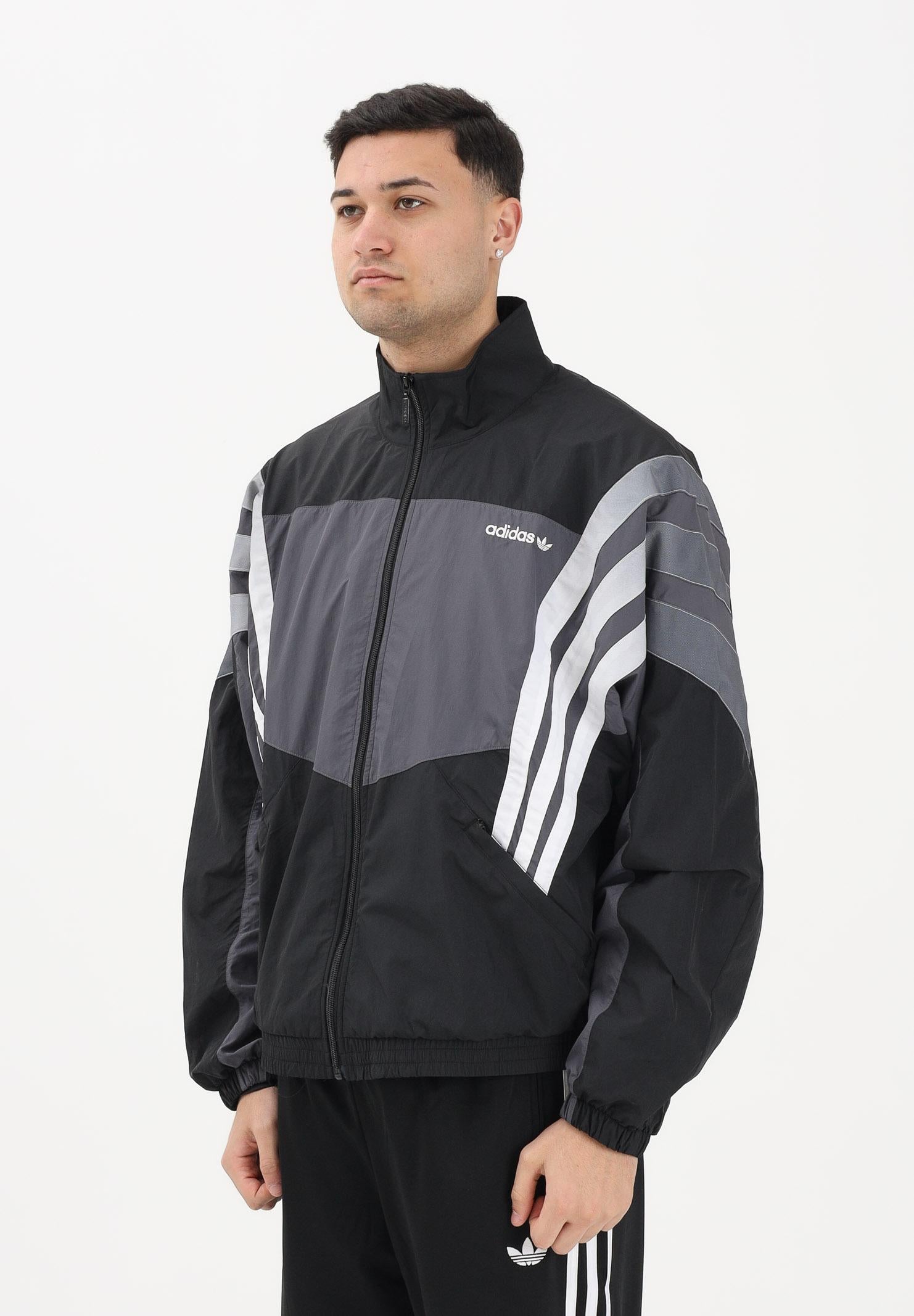 ADIDAS ORIGINALS Giacca a vento SANTIAGO nera e grigia da uomo KS8326 . ADIDAS ORIGINALS 