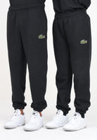 Pantalone sportivo nero per uomo e donna con patch logo XH2750 031 LACOSTE 