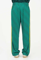 ADIDAS ORIGINALS Pantalone sportivo FIREBIRD LOOSE MONOGRAM verde e giallo da uomo KD0396 . ADIDAS ORIGINALS 