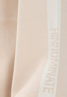 HINNOMINATE Pantalone in maglia beige da donna con banda laterale logata HMABW02131 BE11 HINNOMINATE 