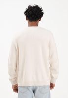 TOMMY JEANS Maglioncino girocollo panna da uomo con logo DM0DM22105AFN . TOMMY JEANS 