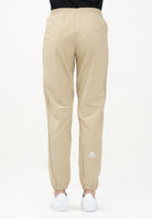 THE NORTH FACE Pantalone antivento Mountain Athletics beige da donna NF0A8BGPLK51 . THE NORTH FACE 