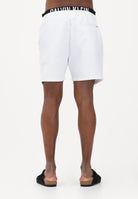 CALVIN KLEIN Shorts mare bianco da uomo con elastico logato LV00N61015 100 CALVIN KLEIN 