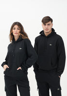 LACOSTE Felpa con cappuccio nera per uomo e donna rifinita da patch logo SH9839 031 LACOSTE 