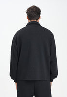 GCDS Felpa con zip nera per uomo e donna caratterizzata da lavorazione monogram B2CM0500TQ6 99 GCDS 