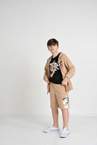 NIKE Completino beige e nero da bambino con logo 9Q0615 023 NIKE 