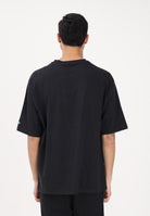 NEW ERA T-shirt a manica corta Oversized Chicago Bulls NBA League Essential nera per uomo e donna 60771515 . NEW ERA 