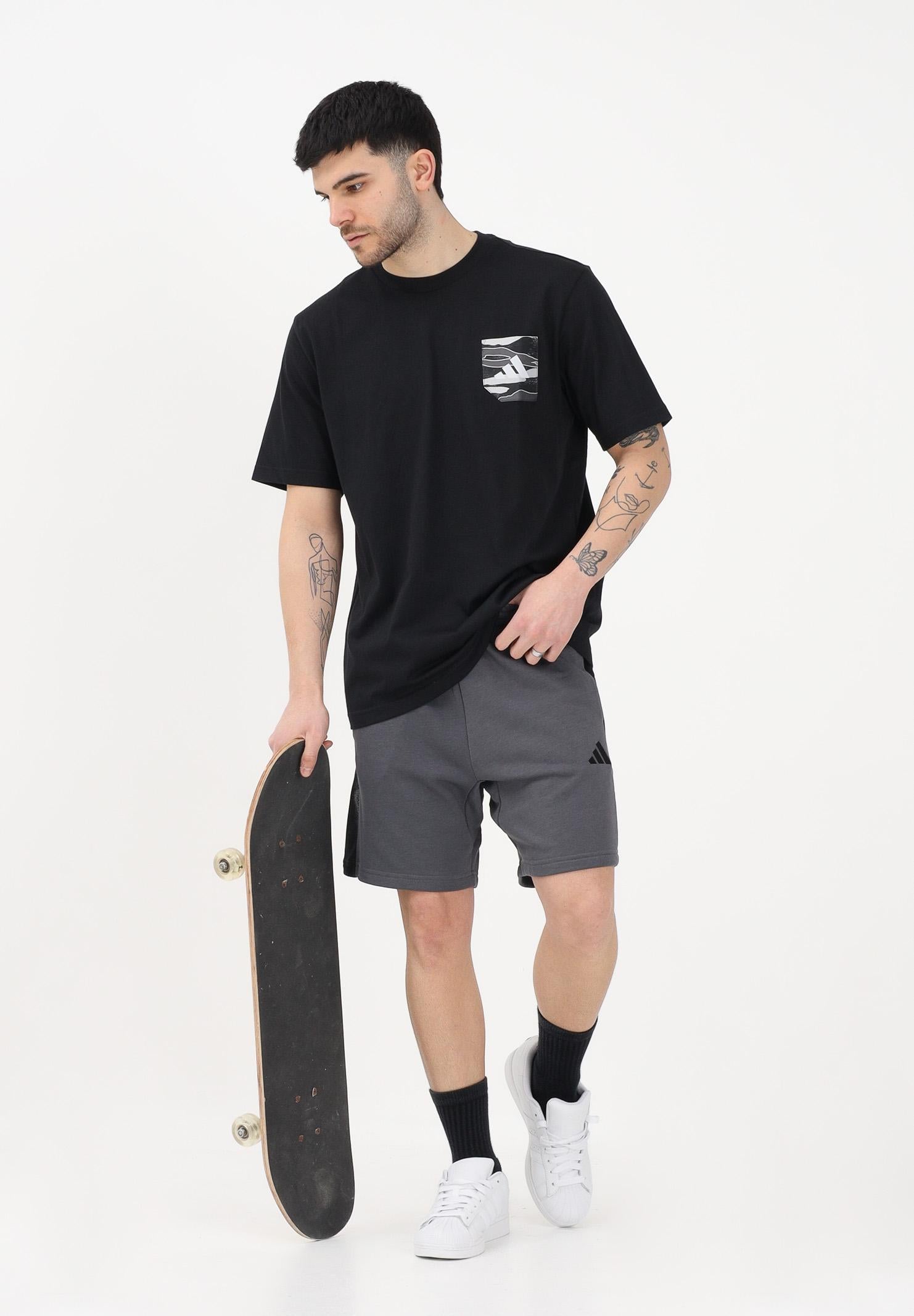 ADIDAS PERFORMANCE T-shirt a manica corta CAMO WOVEN POCKET GRAPHIC nera da uomo JZ7497 . ADIDAS PERFORMANCE 