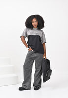 MAISON MARGIELA T-shirt a manica corta nera e grigia per donna, ragazzi e bambini caratterizzata da una costruzione re-cut M60876MM04I M6C37 MAISON MARGIELA 