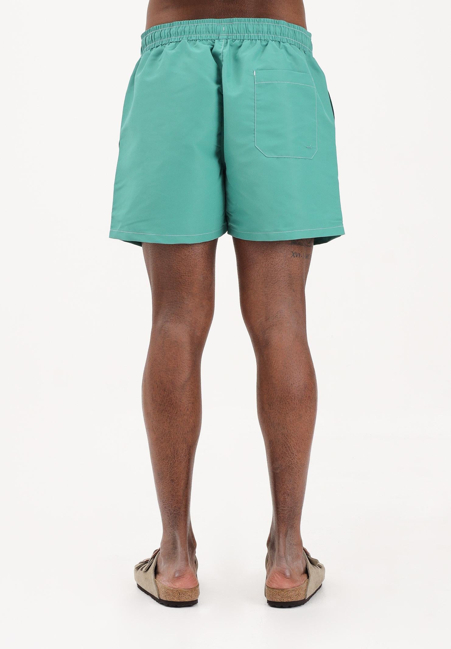 TOMMY HILFIGER Shorts mare verde da uomo con logo UM0UM03852 L5Y TOMMY HILFIGER 