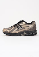 NEW BALANCE Sneakers 1906R nere, beige e oro da uomo U1906RCJ . NEW BALANCE 