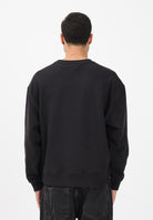 TOMMY JEANS Felpa girocollo nera da uomo stile '90s con distintivo DM0DM22384 BDS TOMMY JEANS 