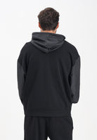 GCDS Felpa con zip nera per uomo e donna caratterizzata da inserti in tessuto tecnico e logo B1XM2001JI1 99 GCDS 