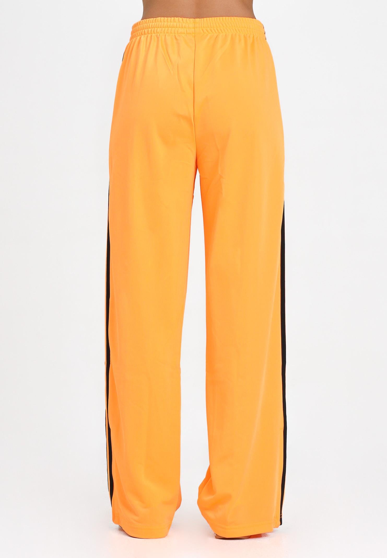 ADIDAS ORIGINALS Pantalone sportivo Adicolor Classic Firebird Loose arancione fluo da donna JY2694 . ADIDAS ORIGINALS 