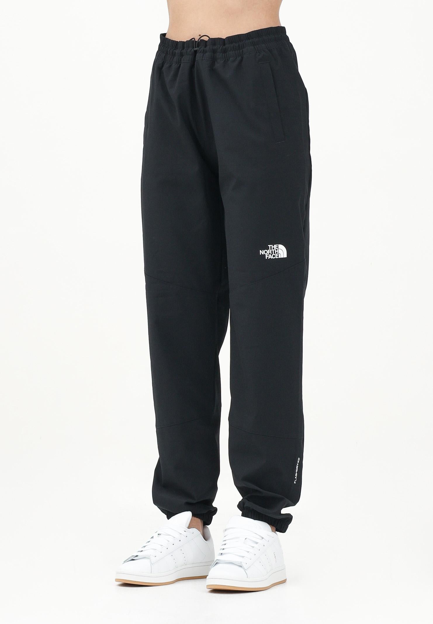 THE NORTH FACE Pantalone antivento Mountain Athletics nero da donna NF0A8BGPJK31  THE NORTH FACE 
