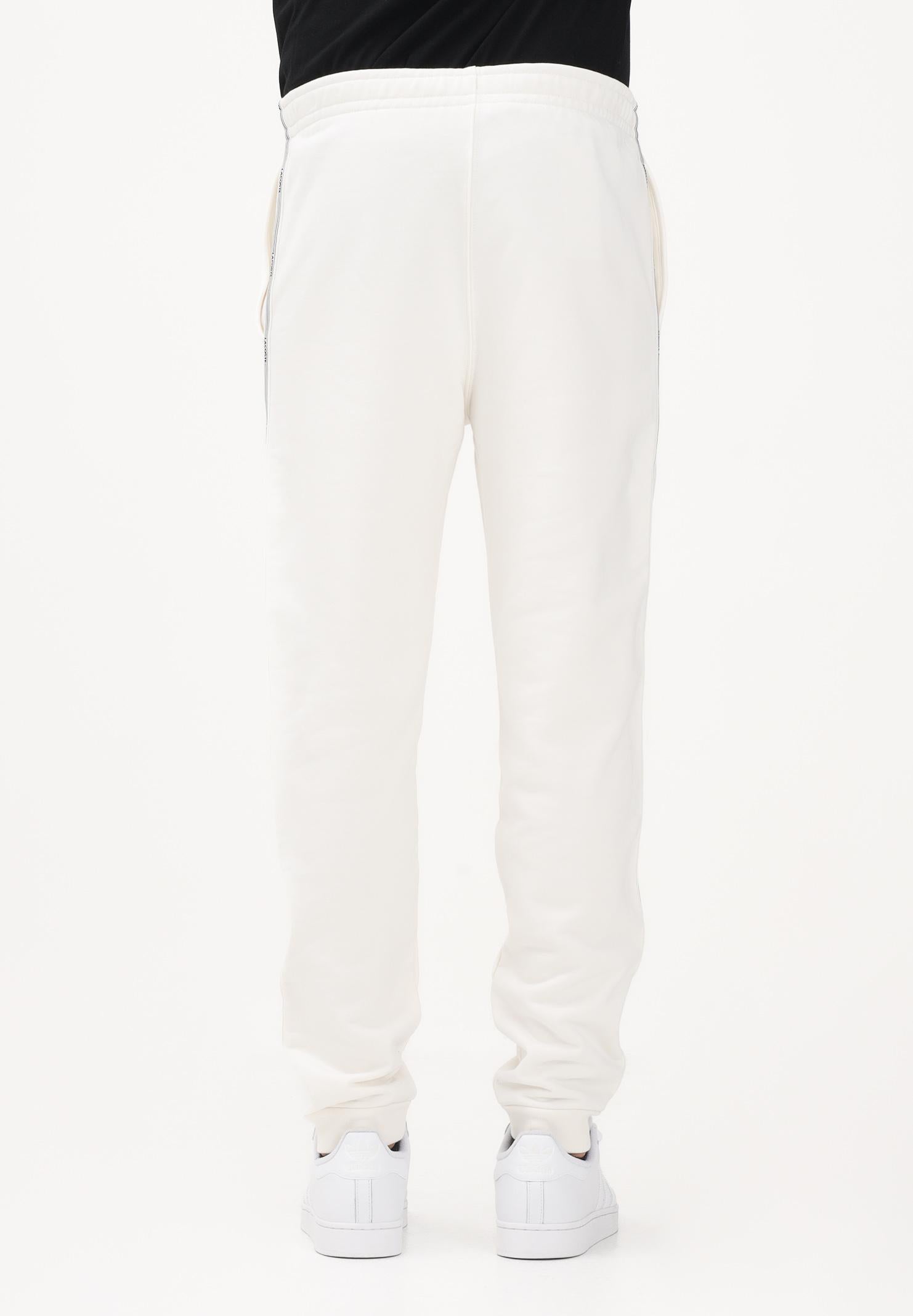 LACOSTE Pantalone sportivo bianco da uomo con rifiniture laterali logate XH0883 70V LACOSTE 