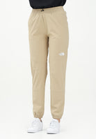 THE NORTH FACE Pantalone antivento Mountain Athletics beige da donna NF0A8BGPLK51 . THE NORTH FACE 