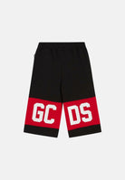 GCDS Shorts nero per bambino e bambina con banda rossa e logo Z0UKQL589F004 999R GCDS 
