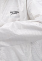 TOMMY JEANS Giacca a vento panna da donna con logo DW0DW20952YBL  TOMMY JEANS 