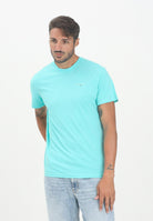 TOMMY JEANS T-shirt a manica corta turchese da uomo con logo DM0DM21780L61  TOMMY JEANS 