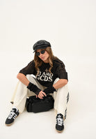 GCDS T-shirt a manica corta nera per uomo e donna con effetto lavato e stampa B2CM2315JF1 99 GCDS 