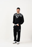 MARCELO BURLON COUNTY OF MILAN Pantalone sportivo nero da uomo con stampa F5CAMAFP044 110 MARCELO BURLON COUNTY OF MILAN 