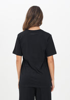 MAISON MARGIELA T-shirt a manica corta nera per donna, ragazzi e bambini arricchita da un logo Hand Written M60897MM02Y M6900 MAISON MARGIELA 