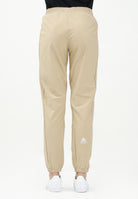 THE NORTH FACE Pantalone antivento Mountain Athletics beige da donna NF0A8BGPLK51  THE NORTH FACE 