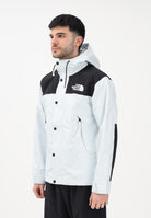 THE NORTH FACE Giacca a vento Reign On celeste e nera da uomo NF0A8B5GJL61 . THE NORTH FACE 