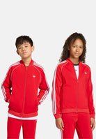 ADIDAS ORIGINALS Felpa con zip SST rossa per bambino e bambina KE2857 . ADIDAS ORIGINALS 