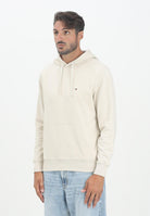 TOMMY HILFIGER Felpa con cappuccio panna da uomo rifinita da logo MW0MW37235ACG  TOMMY HILFIGER 