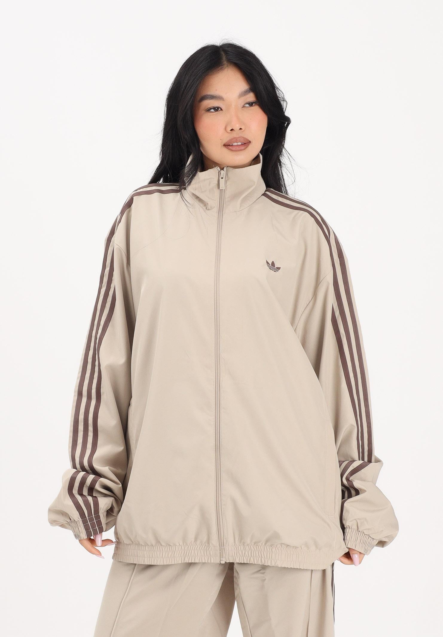 ADIDAS ORIGINALS Giacca a vento Firebird Adilenium beige da donna KD6297 . ADIDAS ORIGINALS 