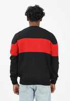 GCDS Maglioncino girocollo nero per uomo e donna impreziosito da banda a contrasto e logo B2CM1505KI4 99 GCDS 