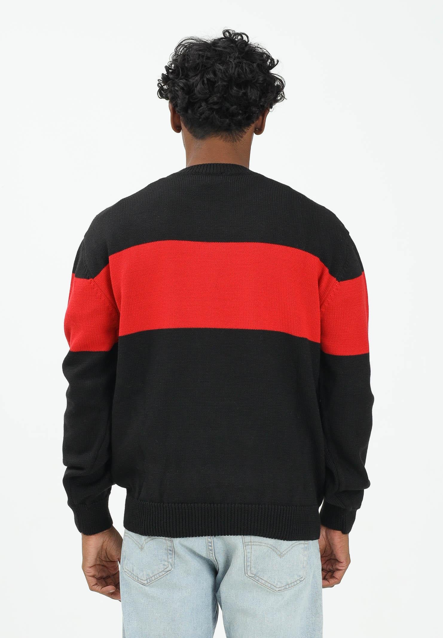 GCDS Maglioncino girocollo nero per uomo e donna impreziosito da banda a contrasto e logo B2CM1505KI4 99 GCDS 