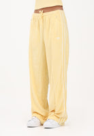 ADIDAS ORIGINALS Pantalone sportivo in spugna asciugamano Firebird giallo da donna KD1413 . ADIDAS ORIGINALS 