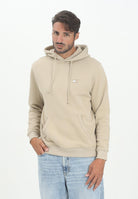TOMMY JEANS Felpa con cappuccio beige da uomo rifinita da logo DM0DM20258RBV  TOMMY JEANS 