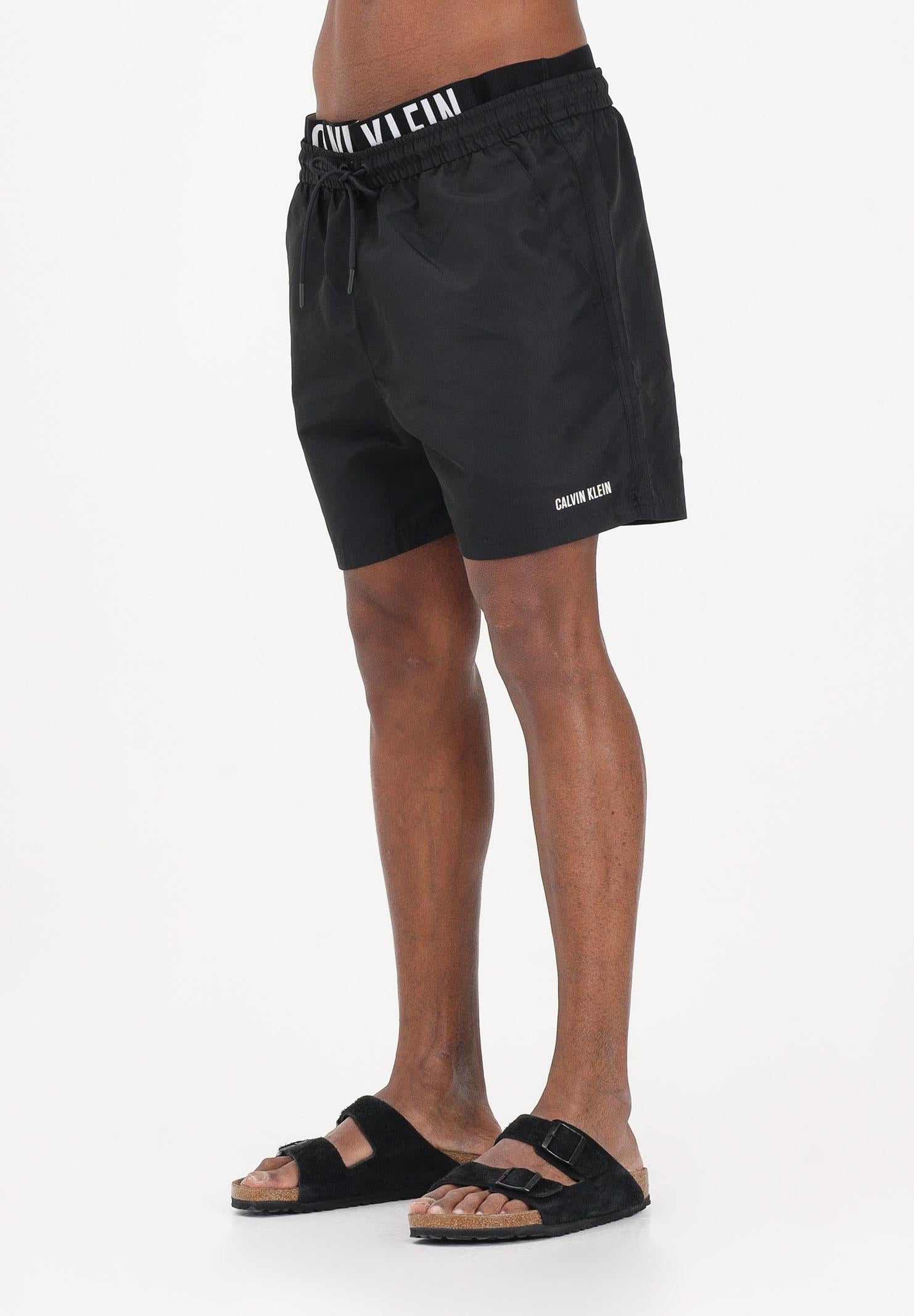 CALVIN KLEIN Shorts mare nero da uomo con elastico logato LV00N61015 UB1 CALVIN KLEIN 