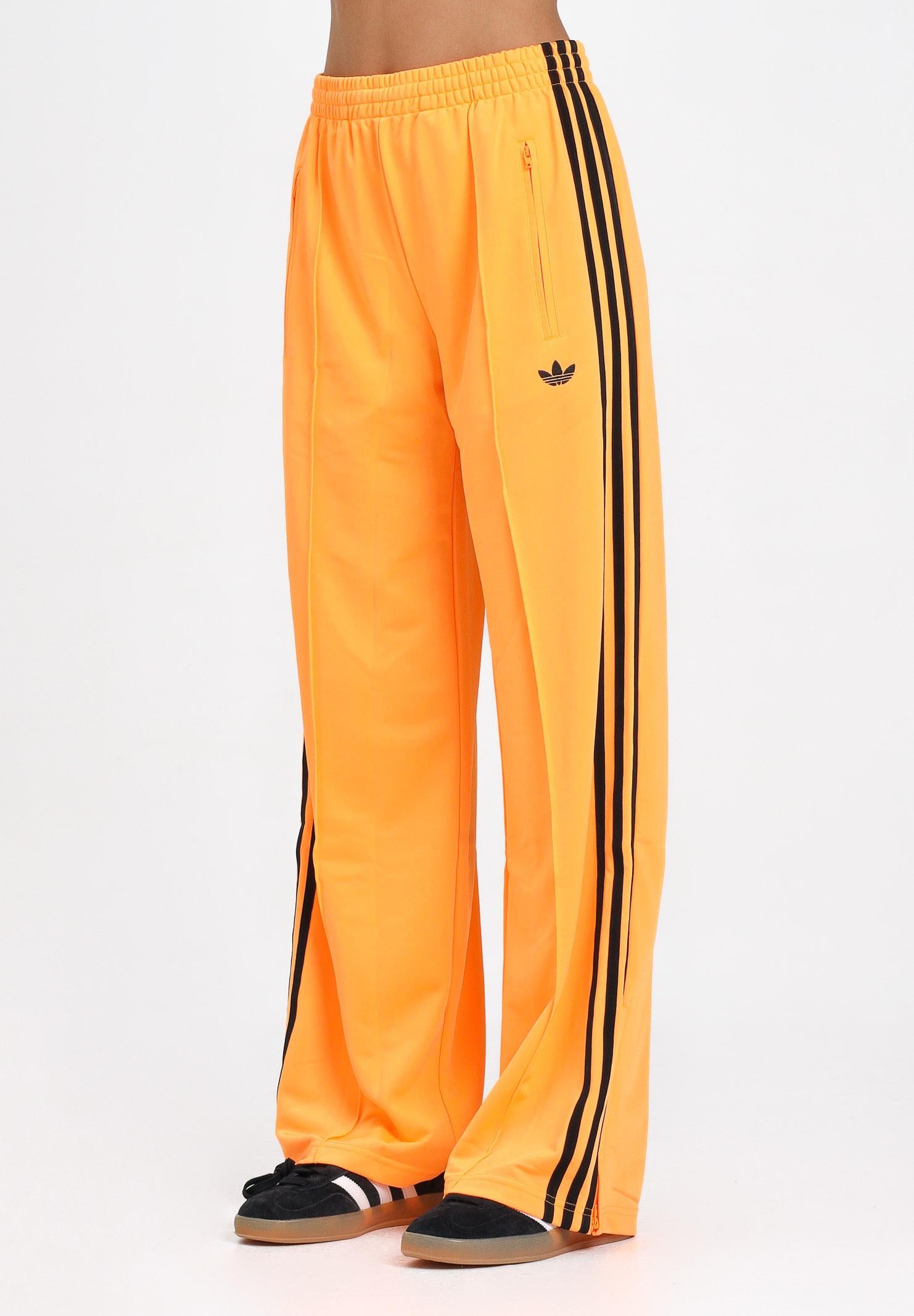 ADIDAS ORIGINALS Pantalone sportivo Adicolor Classic Firebird Loose arancione fluo da donna JY2694 . ADIDAS ORIGINALS 