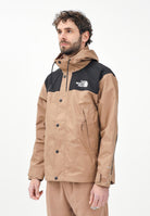 THE NORTH FACE Giacca a vento Reign On marrone e nera da uomo NF0A8B5G58W1 . THE NORTH FACE 