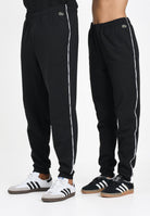 LACOSTE Pantalone sportivo nero per uomo e donna con riga logata XH9803 031 LACOSTE 