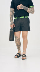 DSQUARED2 Shorts mare nero da uomo con fascia elastica logata D7B646040 004 DSQUARED2 