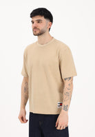 TOMMY JEANS T-shirt a manica corta beige da uomo con maxi stampa sul retro DM0DM22519 AB9 TOMMY JEANS 