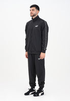 PUMA Tuta Poly Tape nera da uomo 684853 01 PUMA 