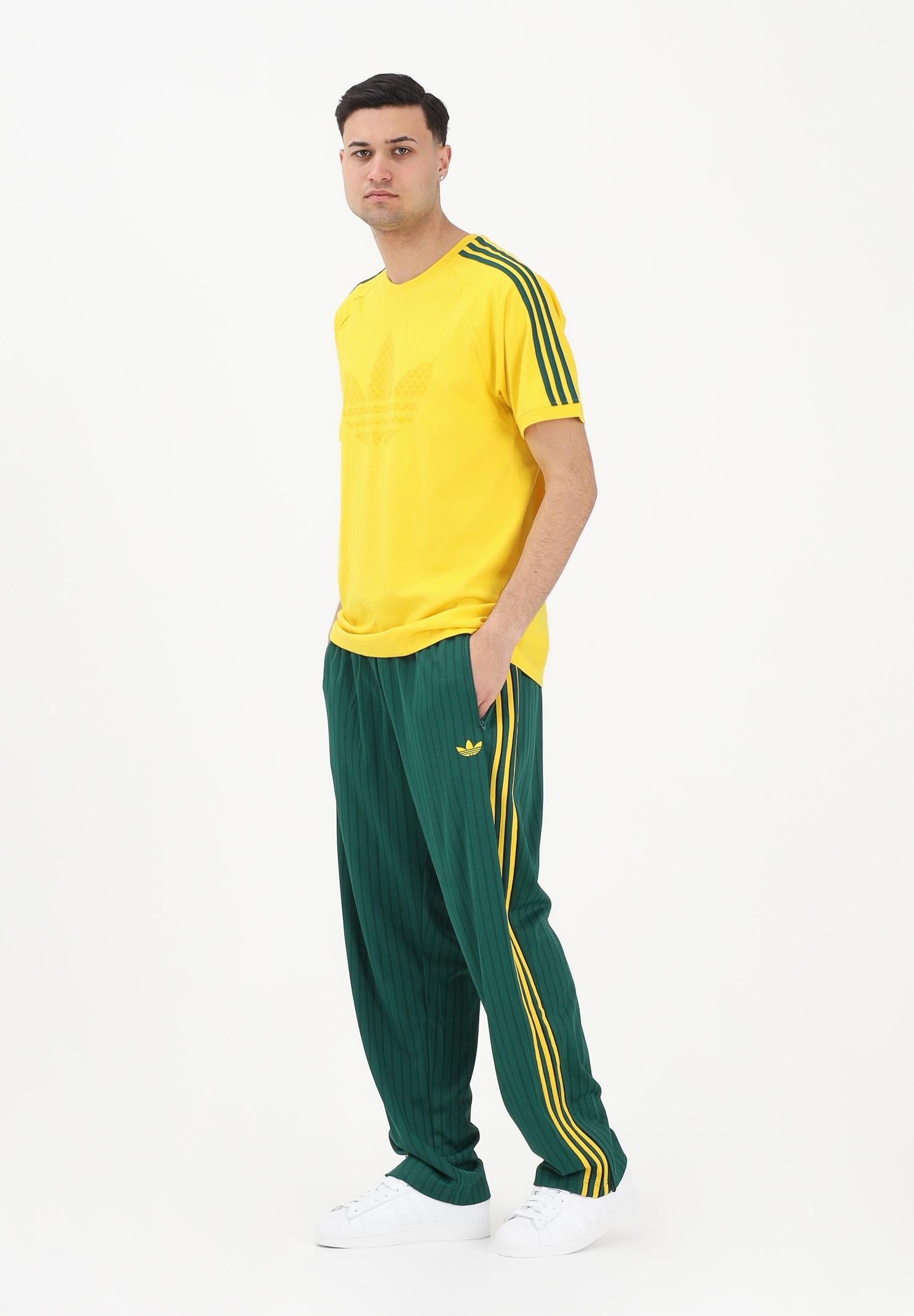 ADIDAS ORIGINALS Pantalone sportivo Firebird Loose Pinstripes verde e giallo da uomo KE3456 . ADIDAS ORIGINALS 