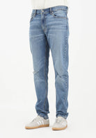 CALVIN KLEIN JEANS Jeans in denim blu chiaro con lavaggio delavé da uomo LV04LB780GRDC . CALVIN KLEIN JEANS 